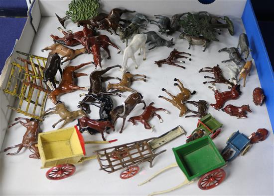 A collection of Britains and other horses, donkeys, carts, fencing, etc